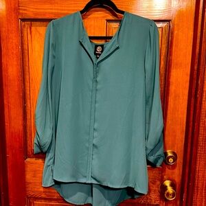 Green tunic style with long of quarter length sleeves